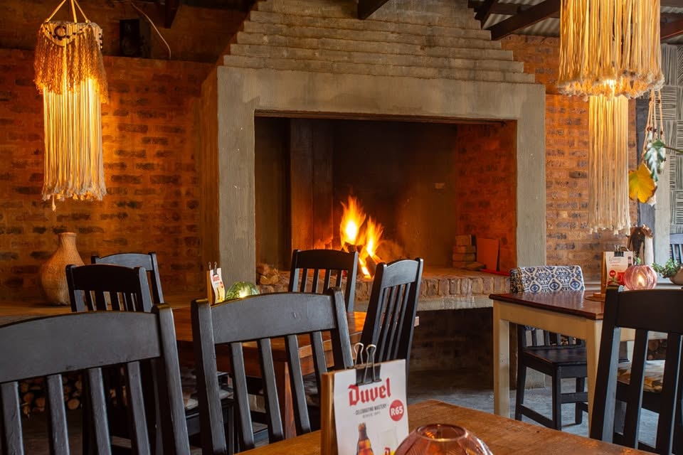 Cosy fireplace and indoor dining at Café Crust